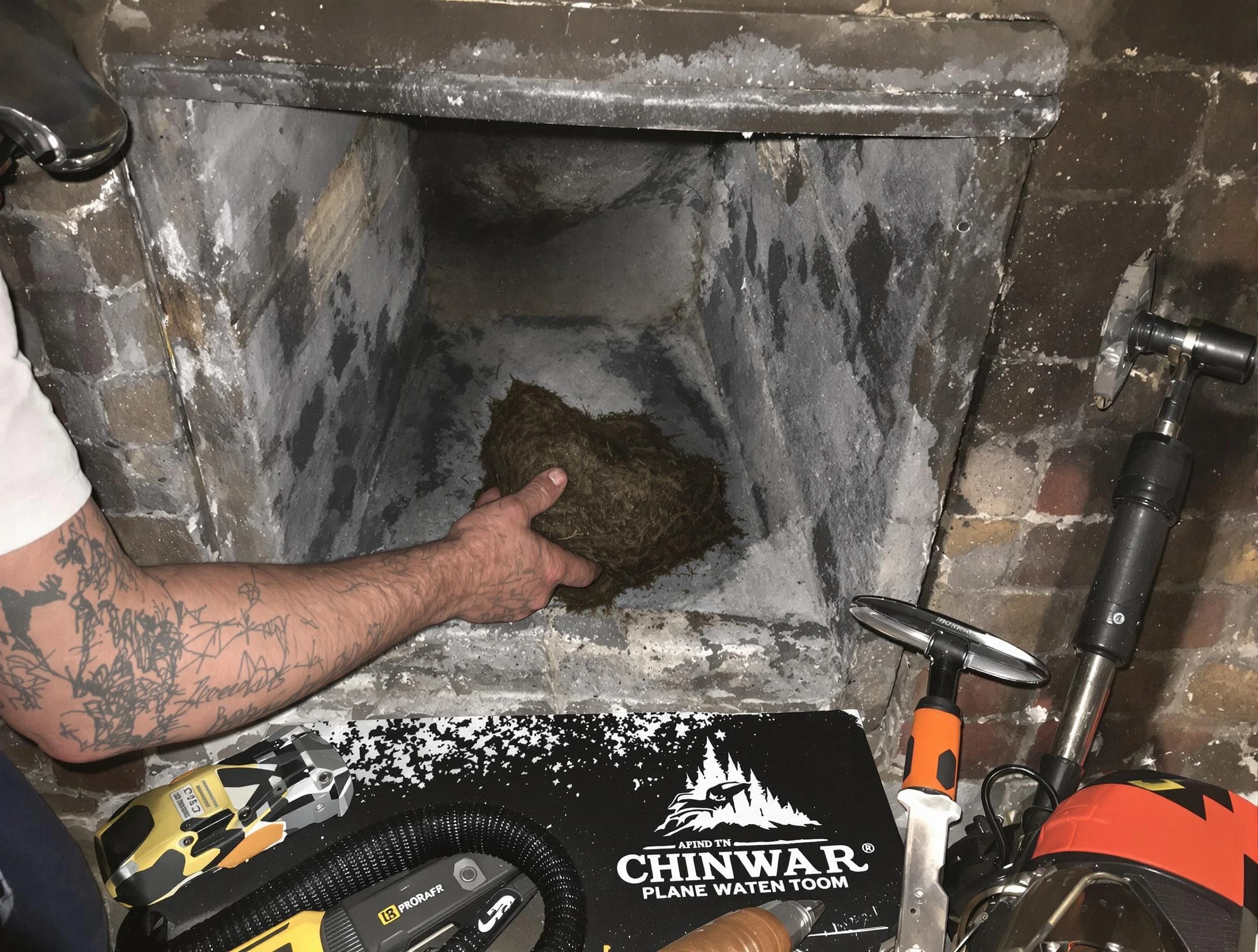 Doraville Chimney Sweep safely removing debris and screening chimney in Doraville, GA